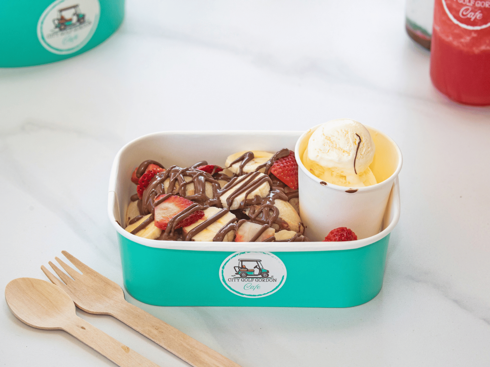 Fluffy pancake topped with rich Nutella sauce, complemented by freshly sliced bananas and strawberries.